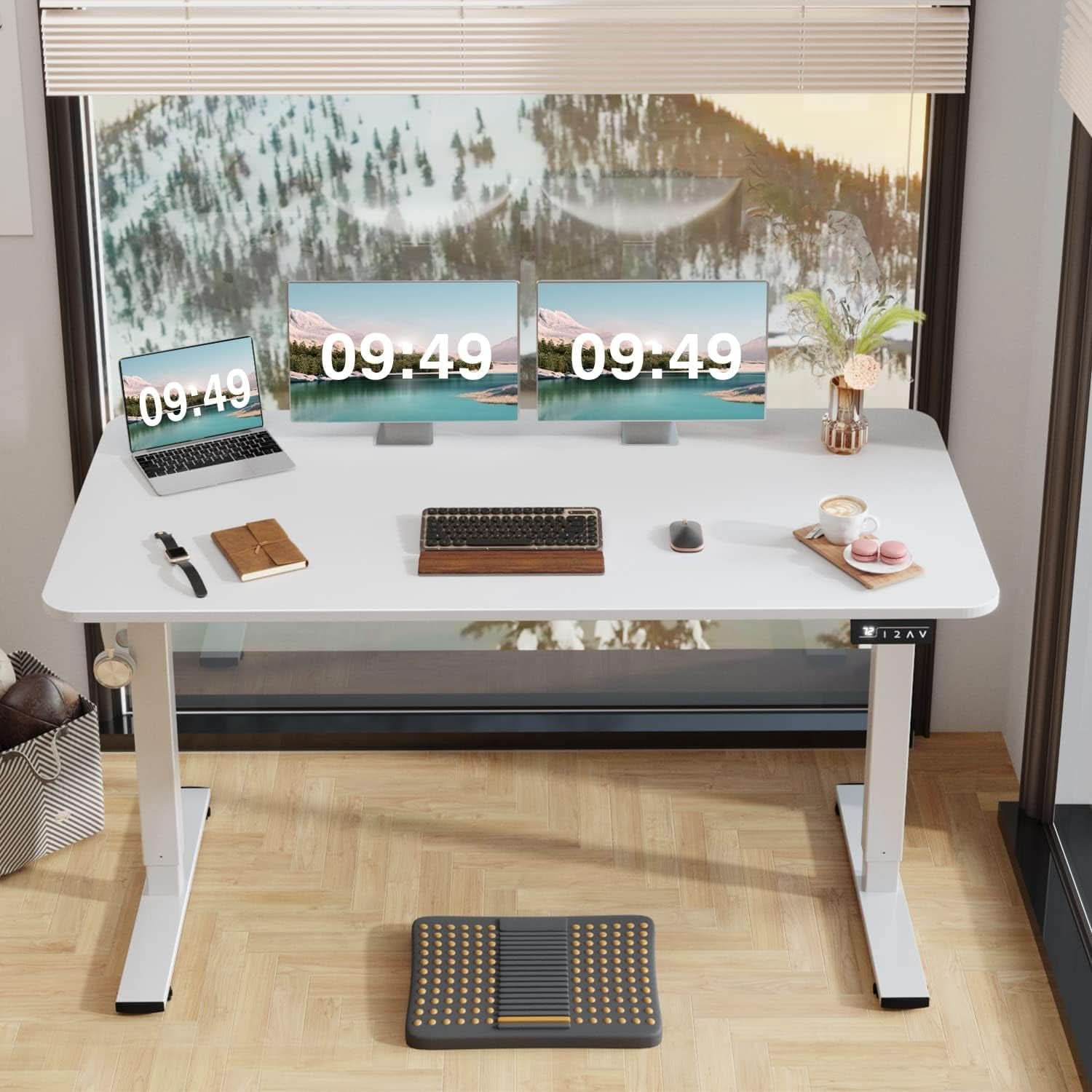Modern office desk setup with multiple monitors, keyboard, and mouse in a bright room.